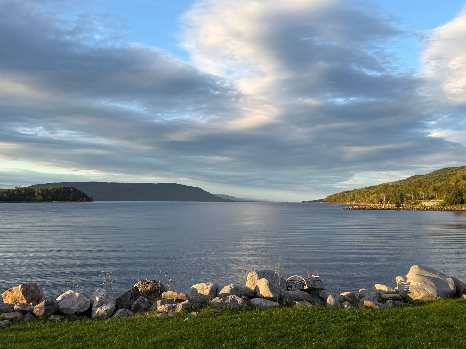 St. Ann's Bay from the lawn at dusk, with a lobster trap on the rocks